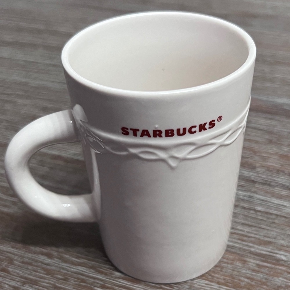 2010‎ Starbucks White Coffee Mug 10 fl oz Red Lettering Embossed Raised Desgin